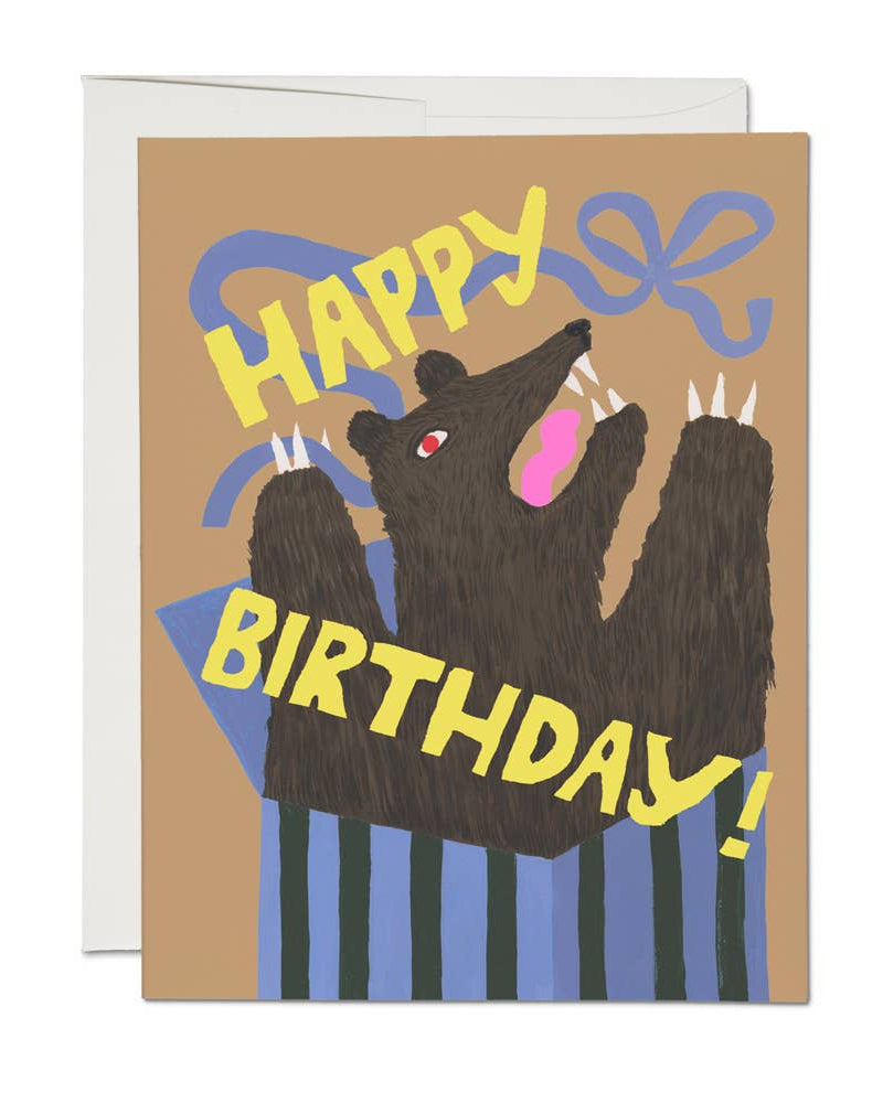 Birthday card with bear illustration and 'Happy Birthday!' text on a brown background